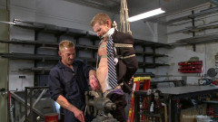 Cocky businessman bound and fucked in the metal shop